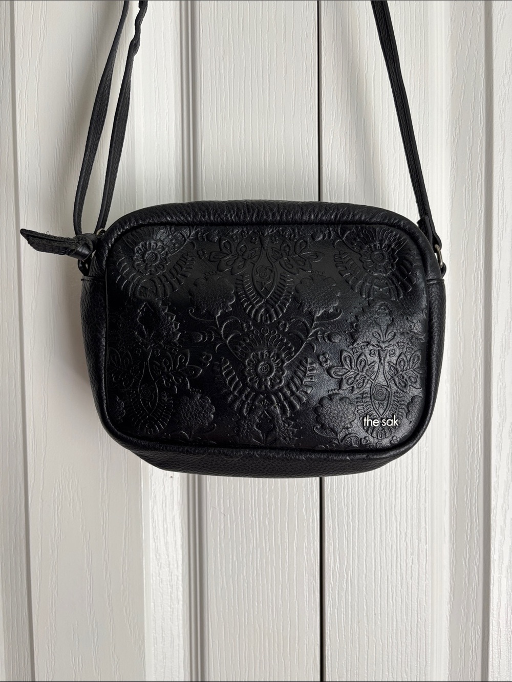 The Sak De Young Leather Camera Crossbody Shoulder Purse. Black Floral Embossed.